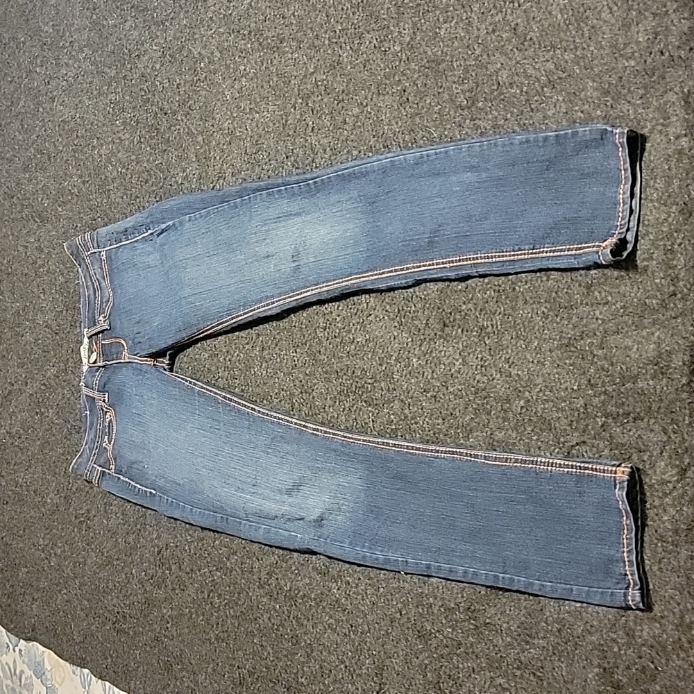 Fragile womens jeans size M measures to a 30 waist while flat.